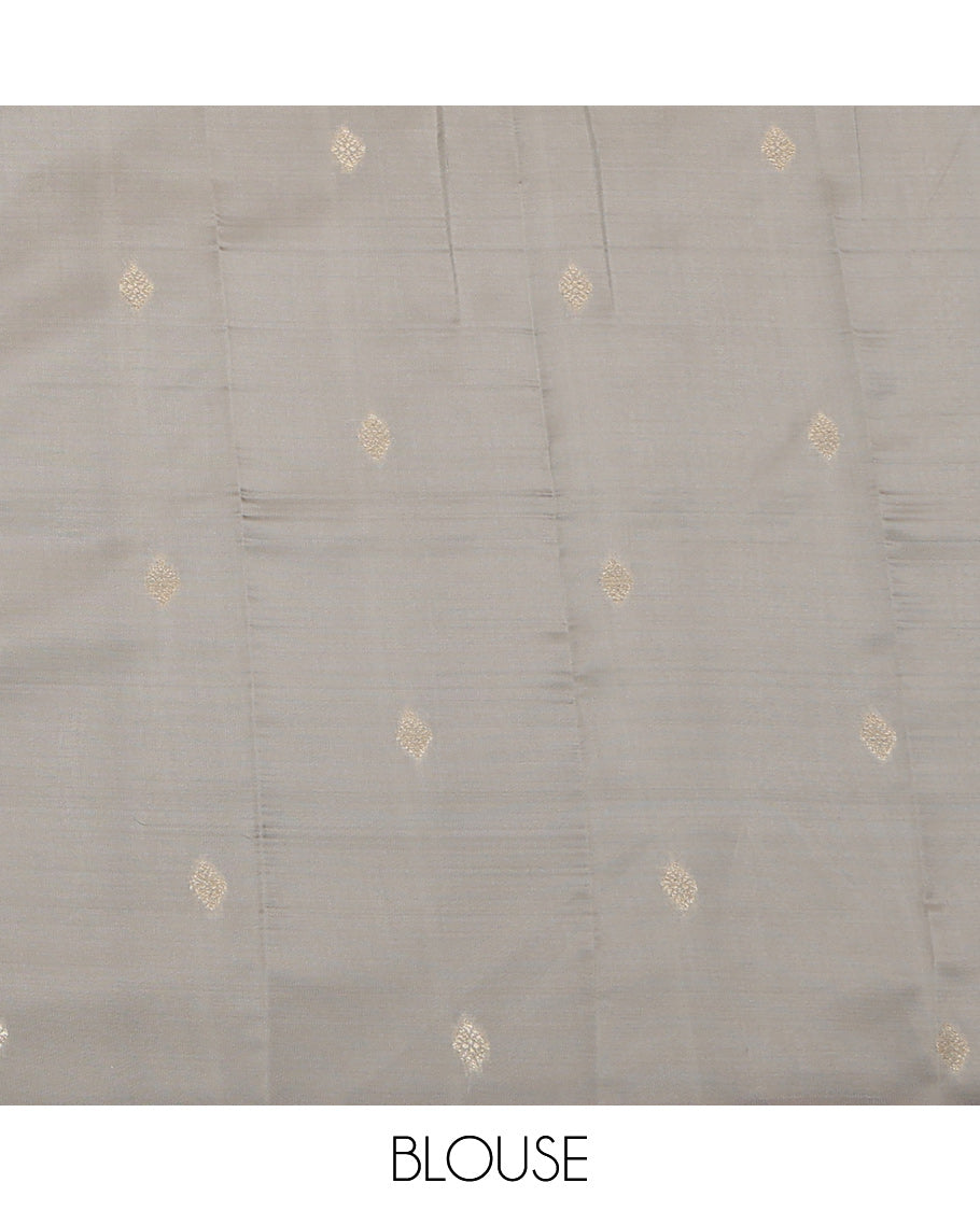 Red Litchi Saree, Detailed with Zari Buttas, a Contrast Traditional Zari Border, a Grand Pallu, and a Contrast Blouse