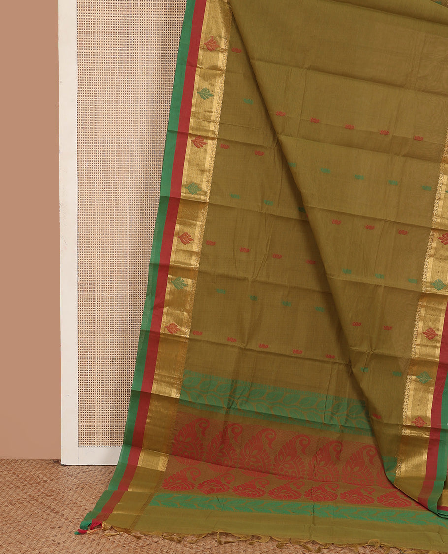 Green buttas kanchi cotton saree, contrast thread and zari border, and pallu of paisley and leaf vine