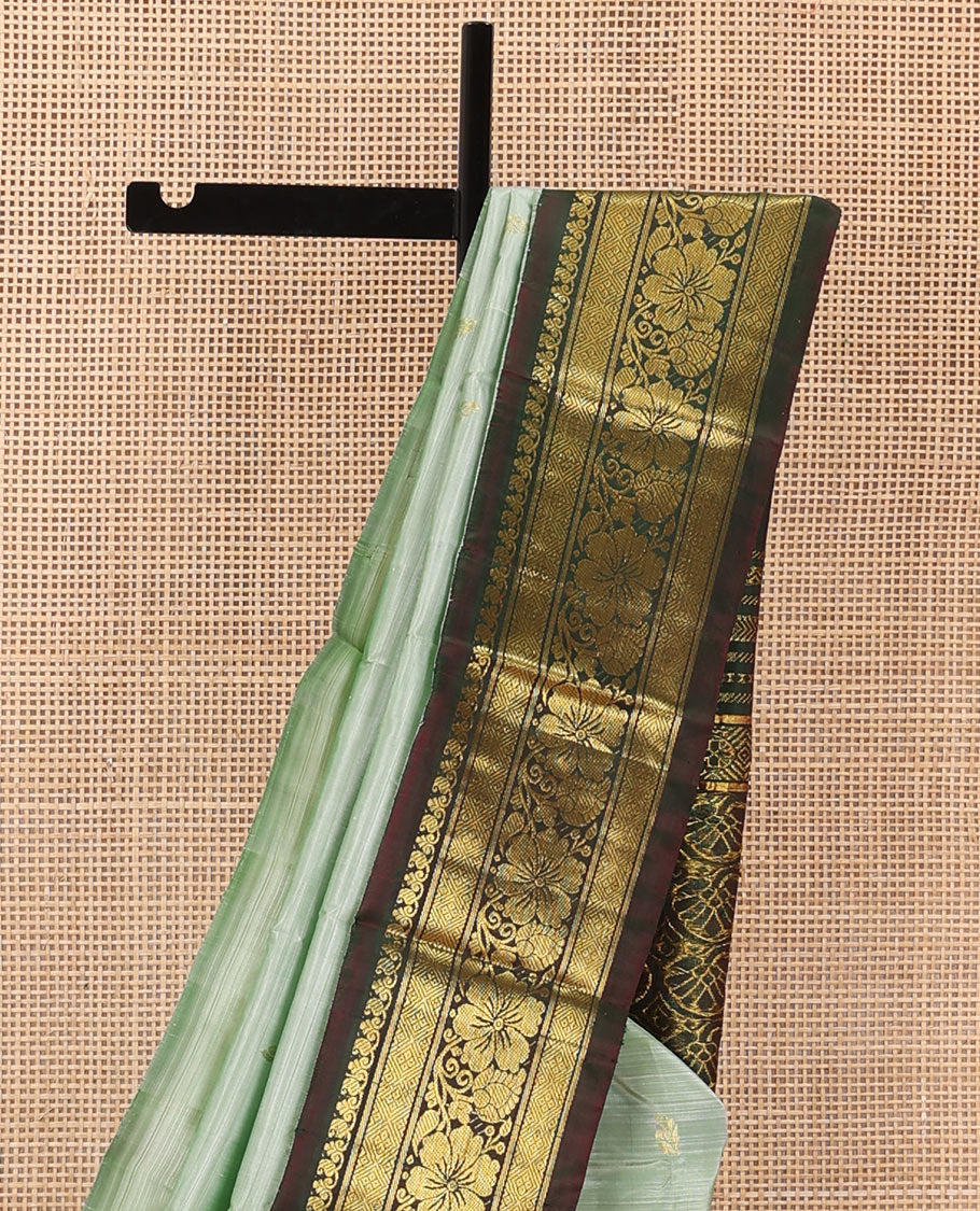Pastel green zari buttas Kanchipuram silk saree, contrast korvai zari border of manga,diamond, and floral designs, and floral jaal pallu
