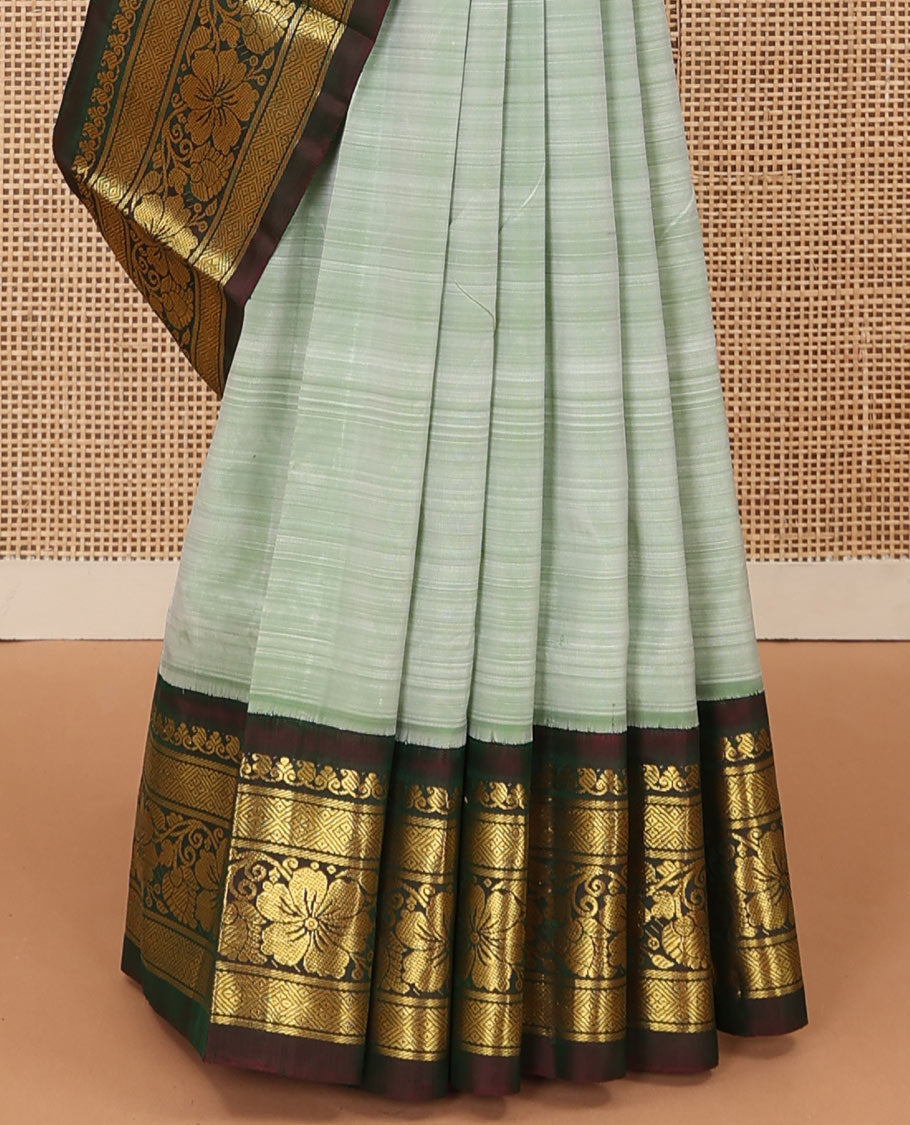 Pastel green zari buttas Kanchipuram silk saree, contrast korvai zari border of manga,diamond, and floral designs, and floral jaal pallu