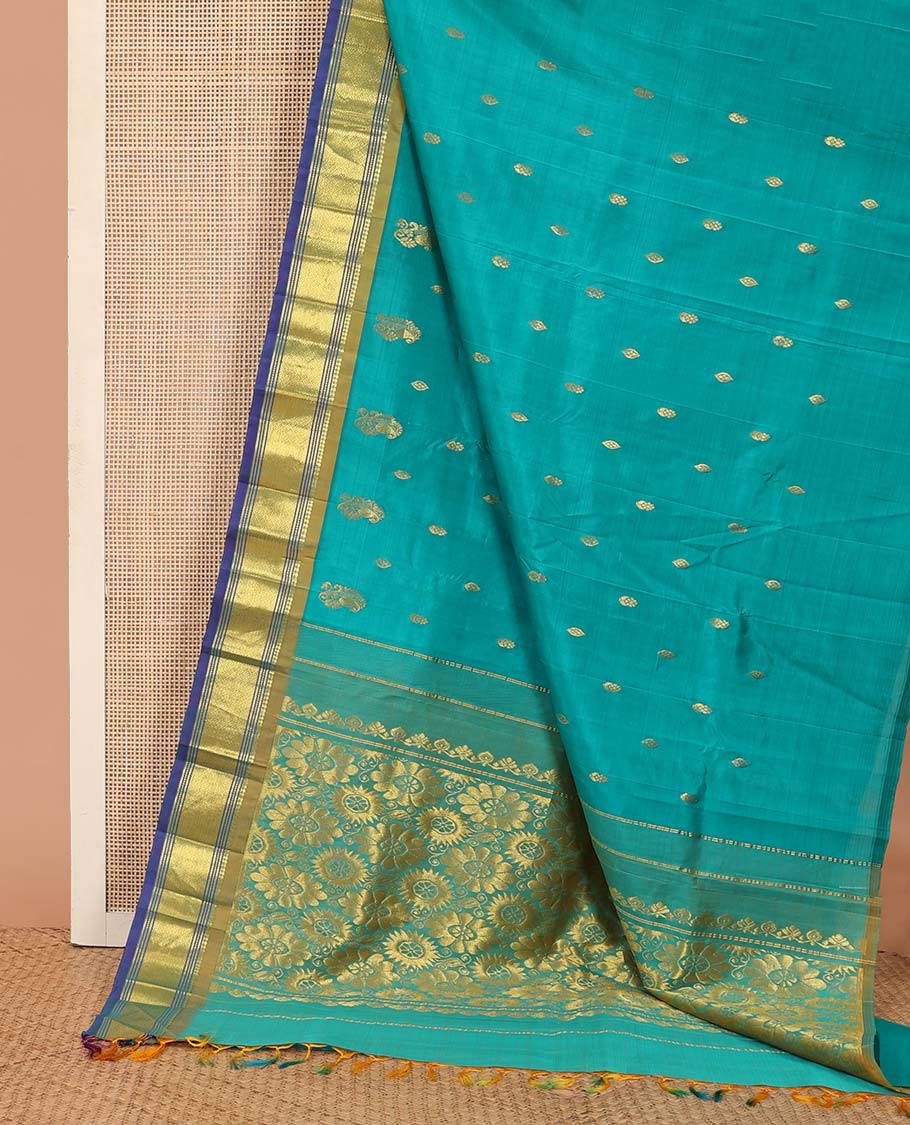 Blue zari buttas Kanchipuram silk saree, contrast border of paneer sombu, banaras, muthu, and mayil kann designs, and floral design pallu
