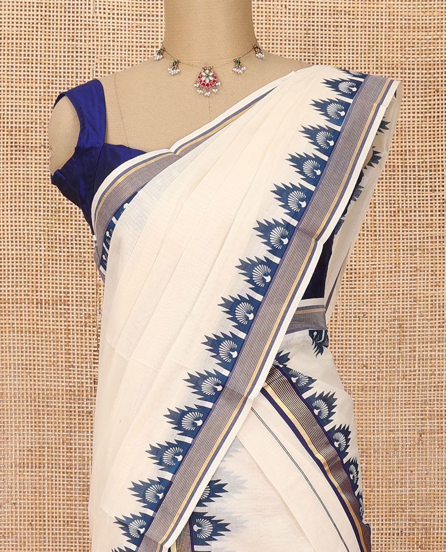 Cream plain Kerala mundu set with contrast blue peacock butta enclosed temple border