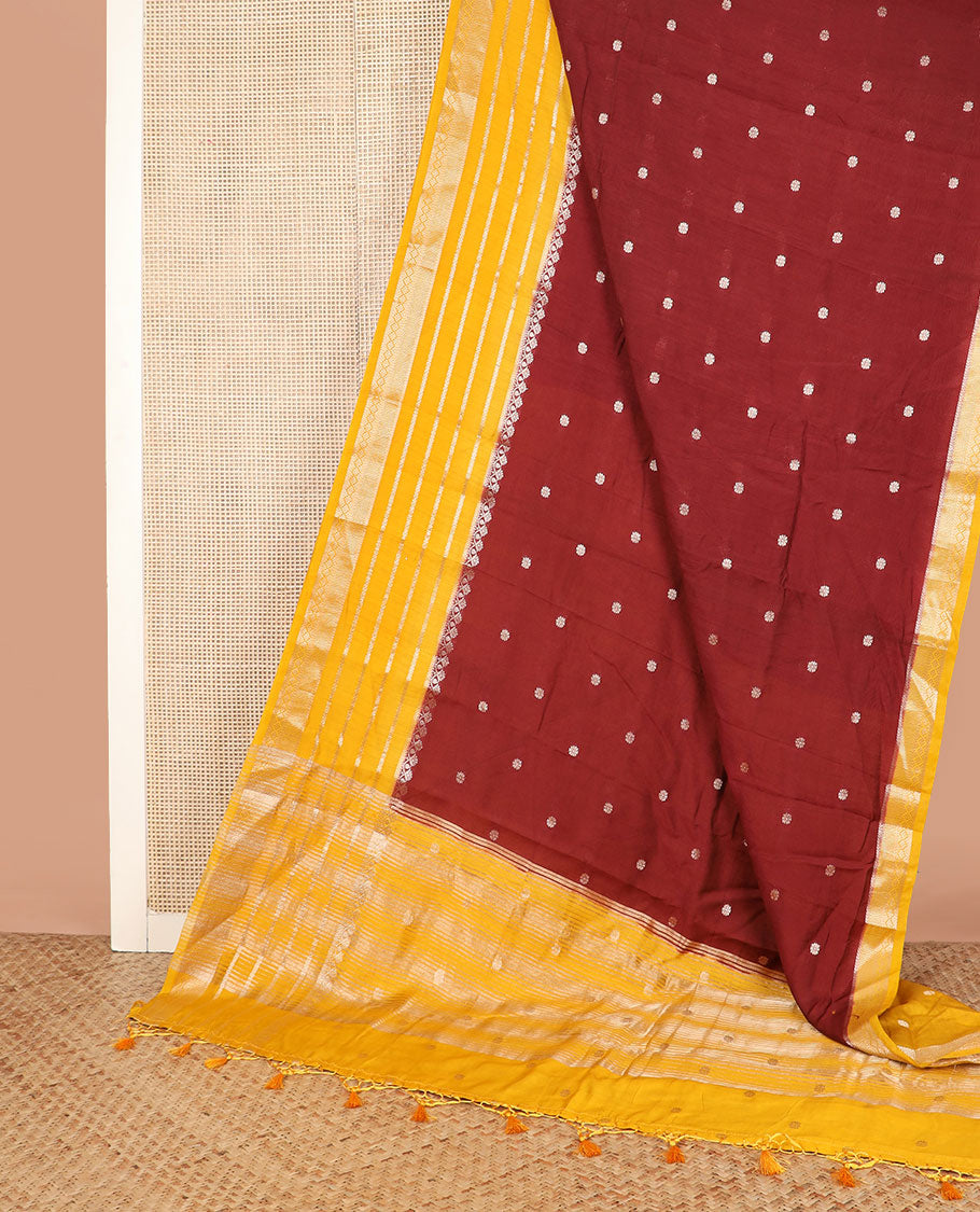 Brown floral buttas assam silk saree, contrast traditional zari border, and pallu of stripes and zari buttas