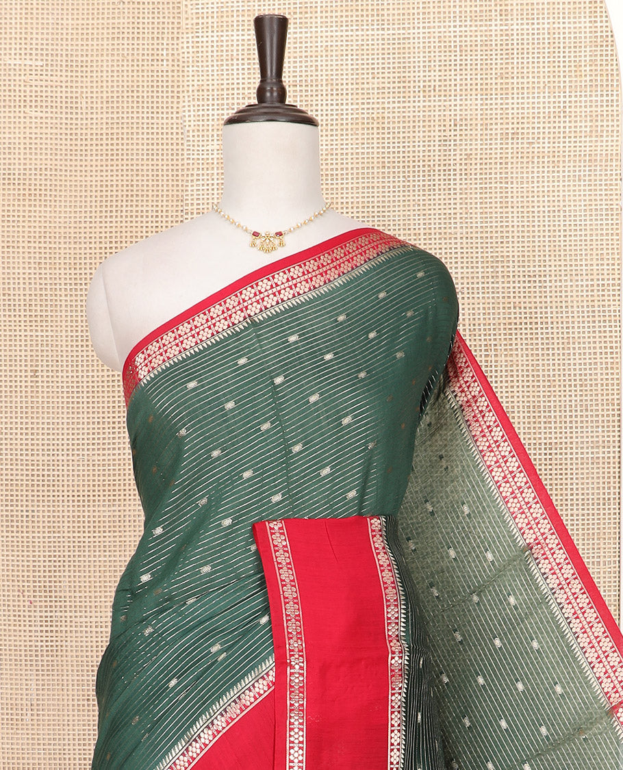Dark Green Assam Silk Saree Woven with Zari Buttas and Stripes, Complemented by a Contrast Traditional Zari Design Border, a Captivating Pallu Featuring Zari Designs, and Paired with a Contrast Blouse