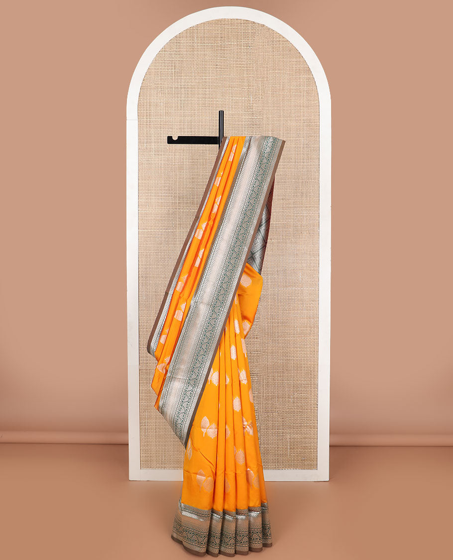 Orange leaf motifs butter silk saree with contrast intricate zari design border & argyle design pallu