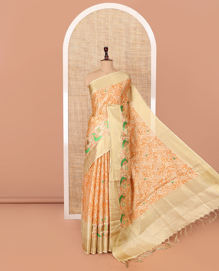 Orange Tissue Cotton Saree, Highlighted by Paisley Print and Paisley-Bird Motifs Embroidery on Its Body, Subtle Bavanji Border, Pallu Mirrors the Same Print, and Paired with a Matching Blouse