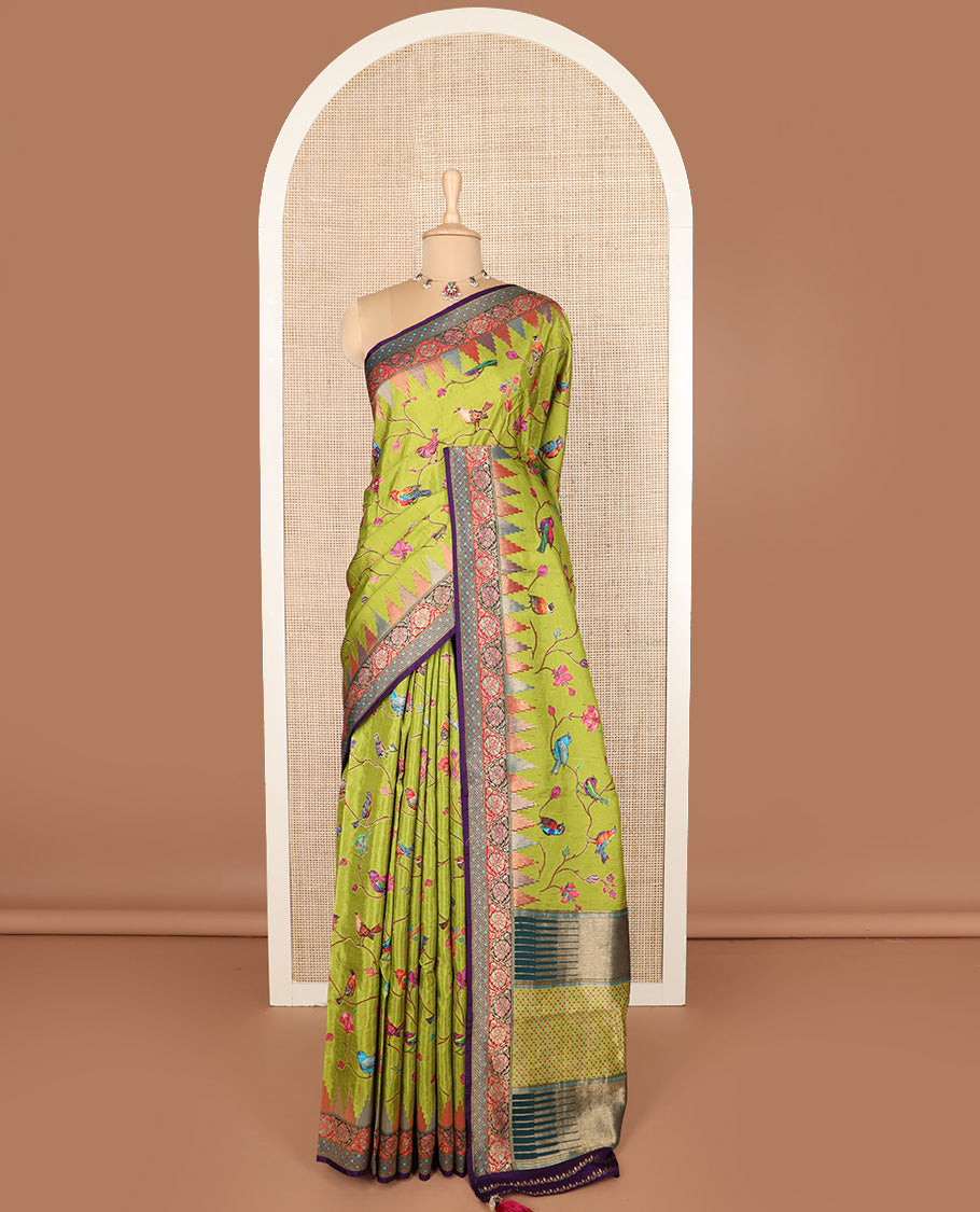 Green floral vine, and birds printed dola silk saree, contrast meenakari floral creeper border, and temple motif pallu
