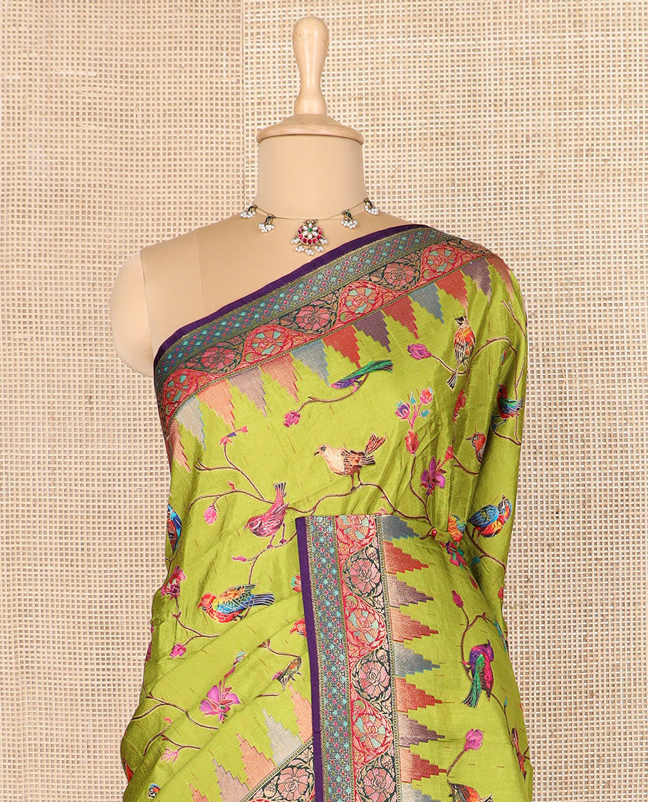 Green floral vine, and birds printed dola silk saree, contrast meenakari floral creeper border, and temple motif pallu