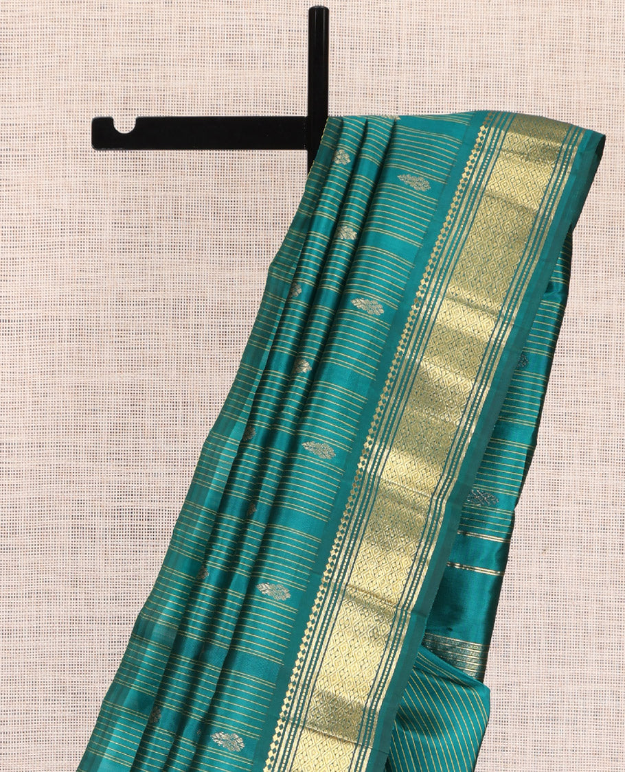 Green Kanchipuram Silk Saree, Subtly Sparkled with Stripes and Buttas, a Zari One-sided Border of Paneer Sombu, Banaras, Muthu, and Jaal Designs, Zari Design Pallu, and No Blouse
