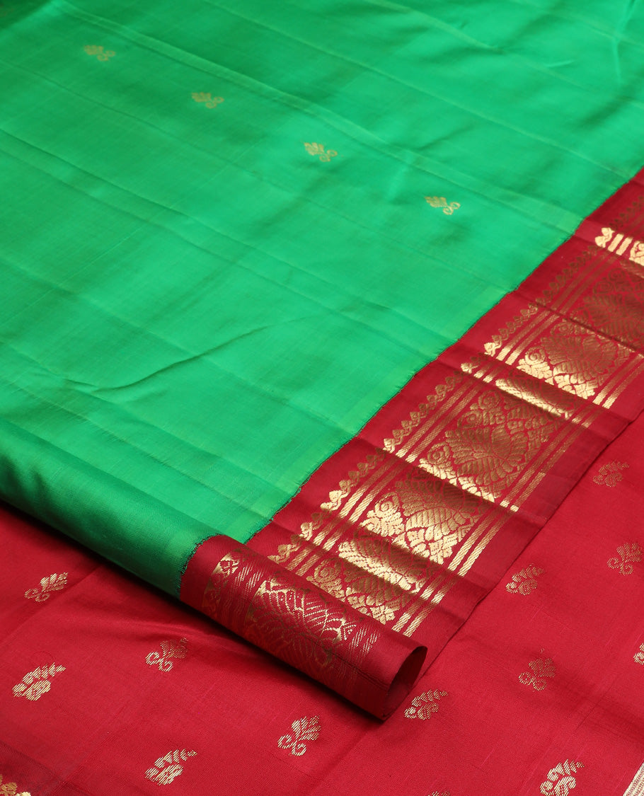 Green zari buttas Kanchipuram silk saree, contrast korvai one-sided zari border, and zari design pallu