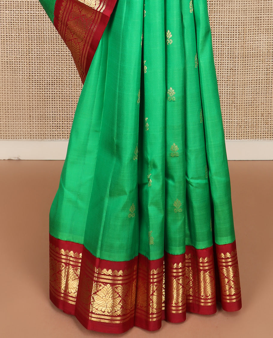 Green zari buttas Kanchipuram silk saree, contrast korvai one-sided zari border, and zari design pallu