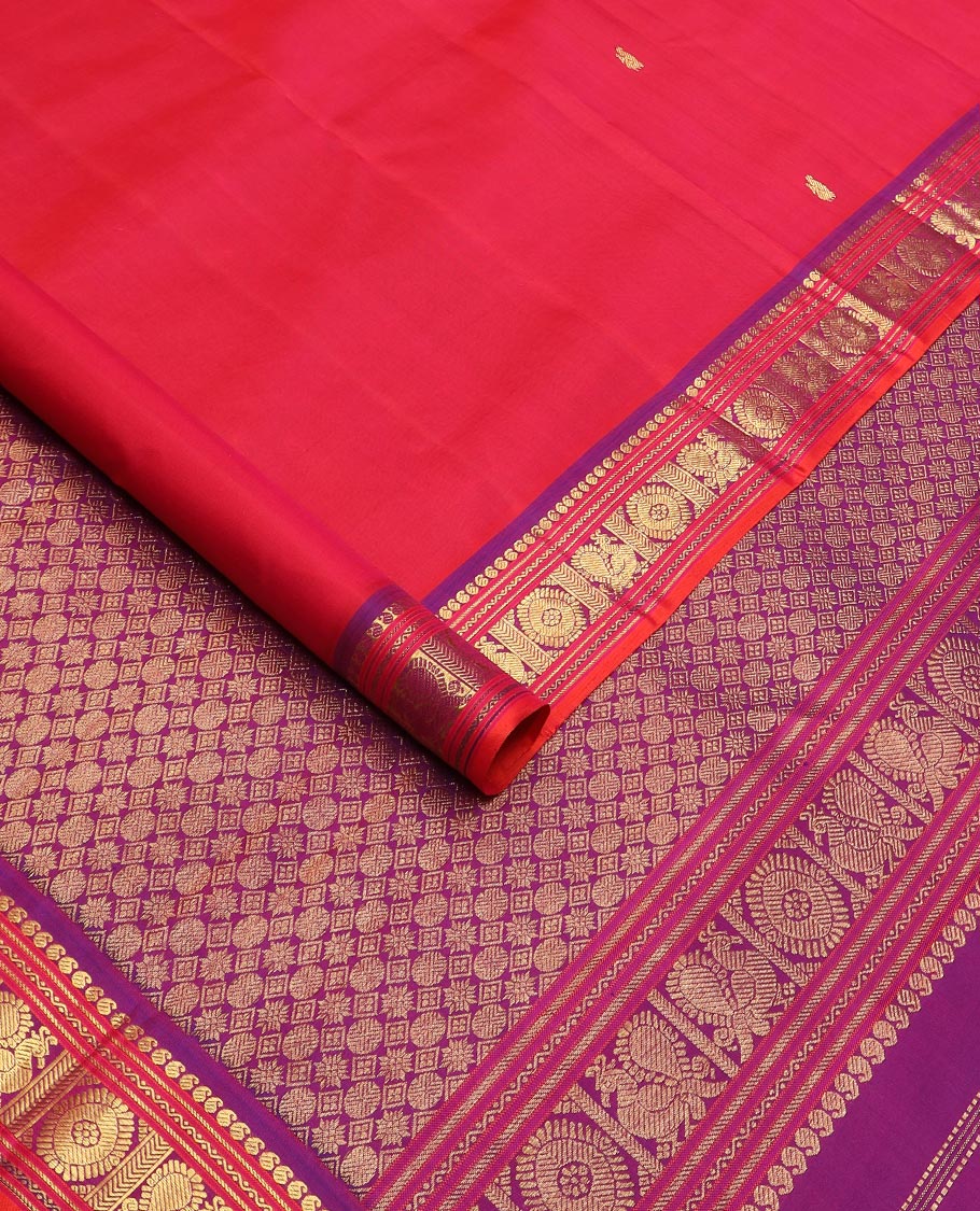 Red zari buttas Kanchipuram silk saree, contrast border of manga, neli, annam and chakram designs, and poun and diamond motifs steeped pallu