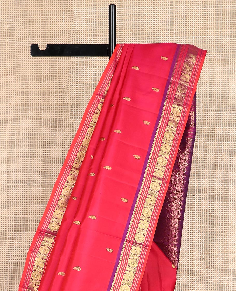 Red zari buttas Kanchipuram silk saree, contrast border of manga, neli, annam and chakram designs, and poun and diamond motifs steeped pallu
