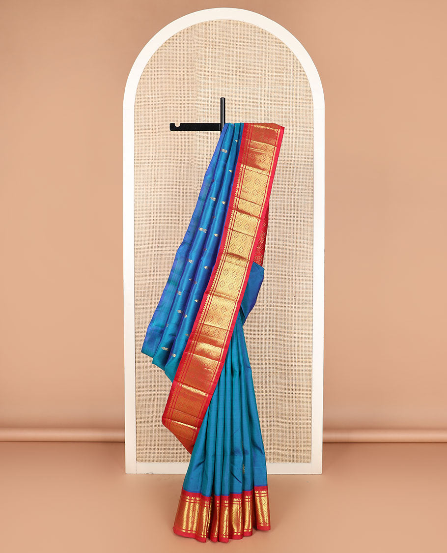 Blue zari buttas Kanchipuram silk saree, contrast korvai border of thilakam mokku, banaras, and jaal designs, and intricate pallu