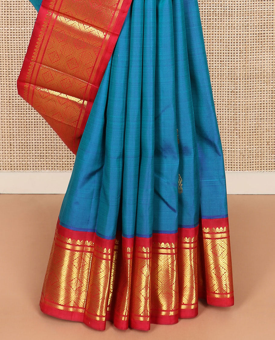 Blue zari buttas Kanchipuram silk saree, contrast korvai border of thilakam mokku, banaras, and jaal designs, and intricate pallu