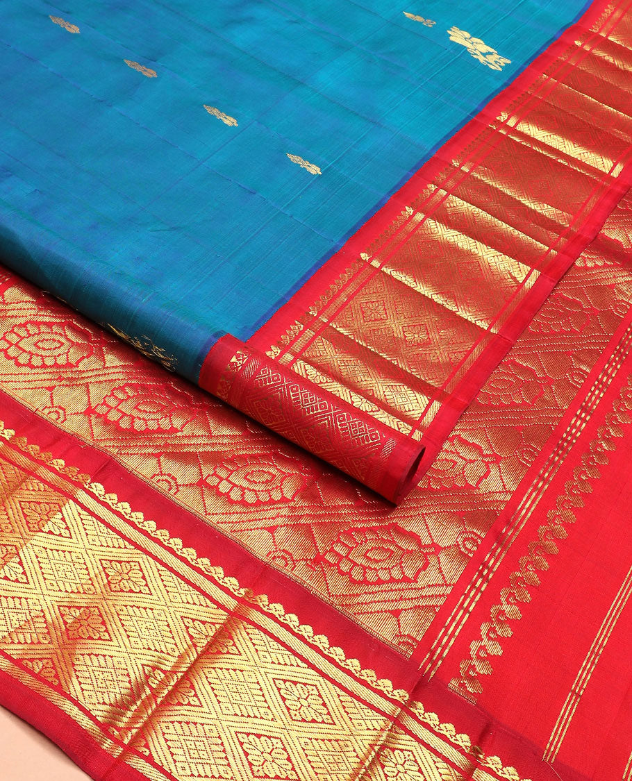 Blue zari buttas Kanchipuram silk saree, contrast korvai border of thilakam mokku, banaras, and jaal designs, and intricate pallu