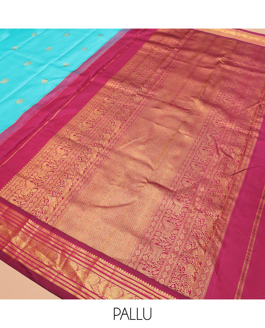 Blue mayil chakram buttas Kanchipuram silk saree, contrast thazampoo rekku border of thilakam mokku, banaras, rudraksham, and mayil designs, and intricate pallu