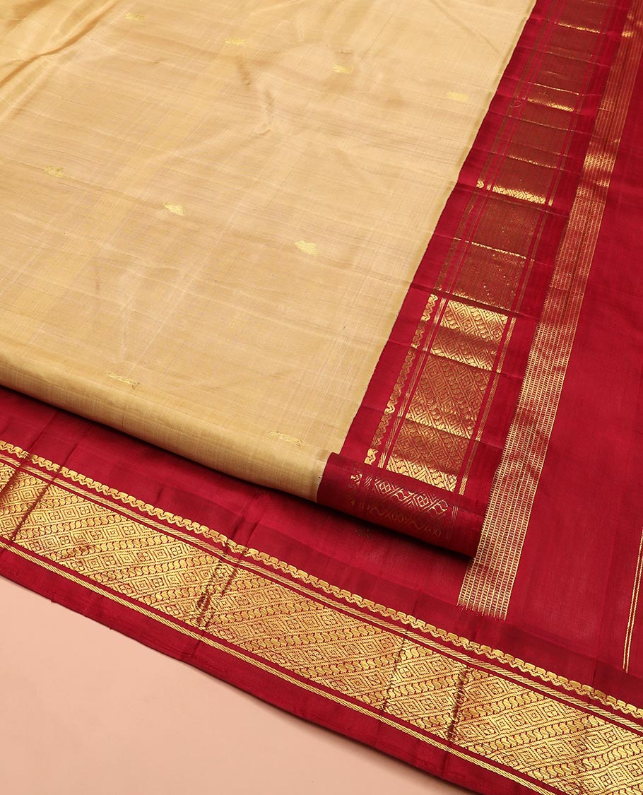 Sandal Kanchipuram Silk Saree Sparsely Sparkled with Zari Buttas All Over Its Body, Complemented by a Contrast One-Sided Korvai Border of Traditional Designs, Pallu of Zari Designs, and Comes Without a Blouse