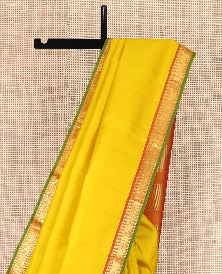 Yellow Plain Kanchipuram Silk Saree, Complemented by Contrast Border of Rekku, Neli, and Yaanai Designs, Pallu of Zari Designs, and Paired with a Contrast Blouse
