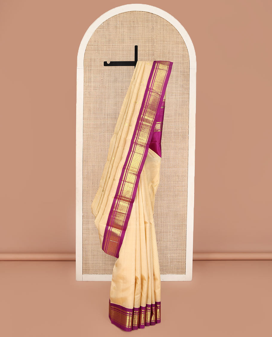 Sandal Kanchipuram Silk Saree, Accentuated with Zari Buttas on Its Body, Complemented by a Contrast One-Sided korvai Border of Thilakam Mokku, Banaras, and Jaal Designs, Pallu Depicts Zari Designs, and Comes Without a Blouse