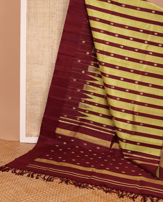 Maroon & sandal striped kancheepuram silk saree with zari buttas, one-sided thazampoo reku border & pallu of zari designs