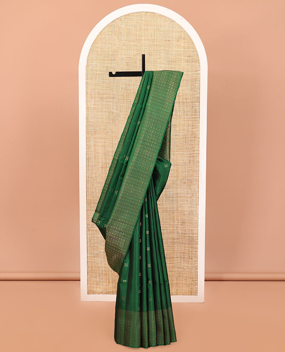 Green Mayuri Soft Silk Saree, Embellished with Zari Buttas All Over Its Body, Highlighted by Zari Border of Kamalam Designs, Pallu of Intricate Designs, and Paired with a Matching Blouse