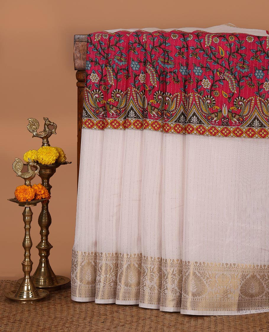 White and rani pink dola silk saree with zari stripes and kalamkari-theme motifs printed on its center of the body, golden zari jacquard border & zari design blouse