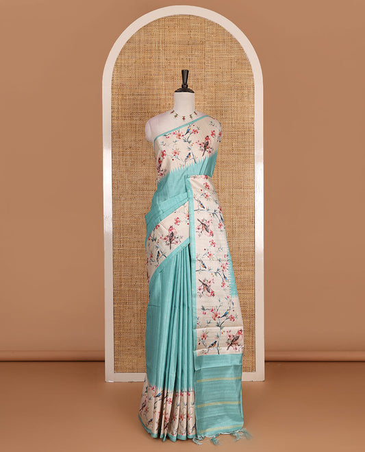Sea green gold zari dotted buttas semi tussar saree, contrast temple border of floral vine, and sparrow motifs digital print, striped pallu, and printed blouse