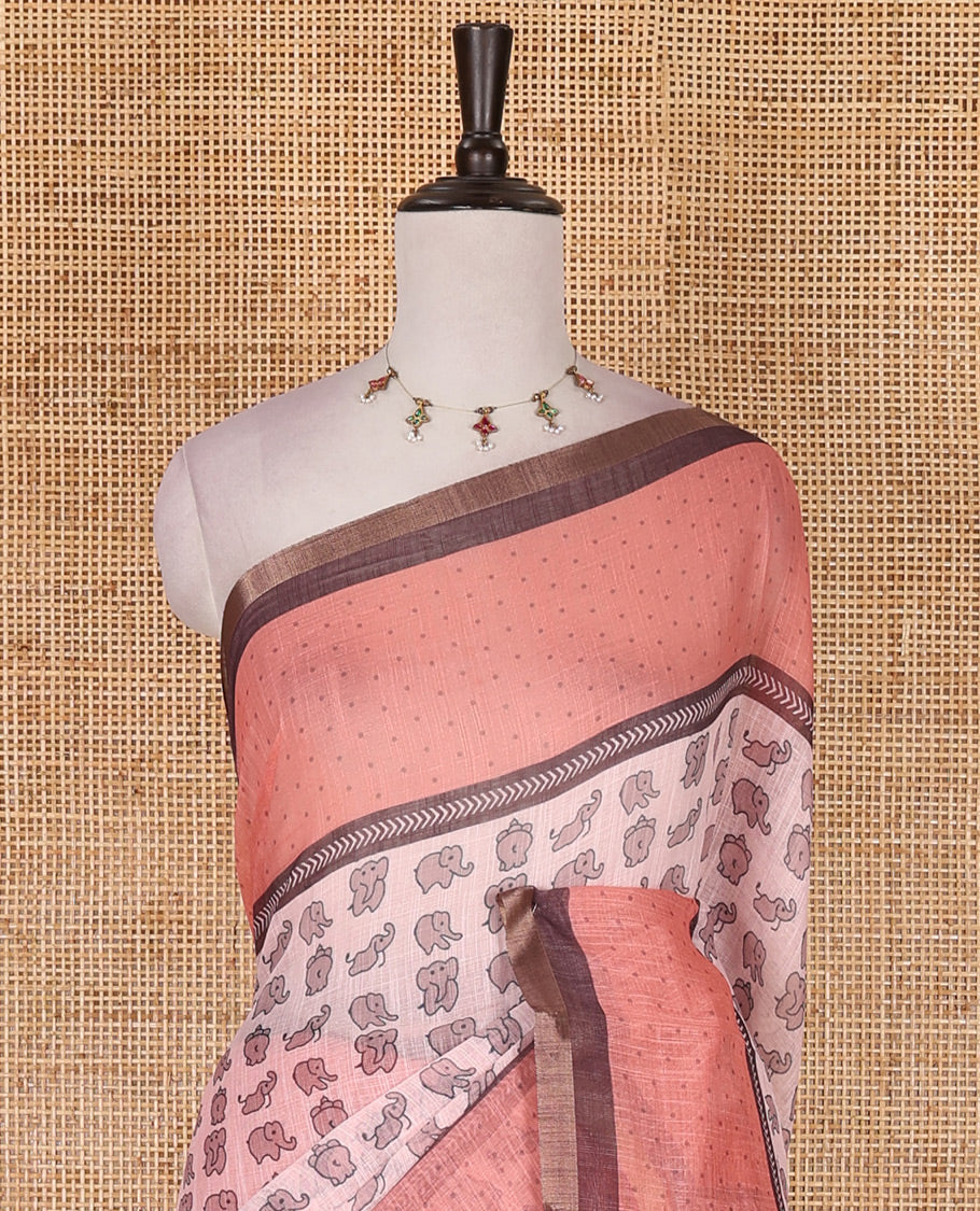 Pastel pink cute elephant motifs printed linen cotton saree, contrast chevron border, pallu of stripes and chevron, and contrast printed blouse
