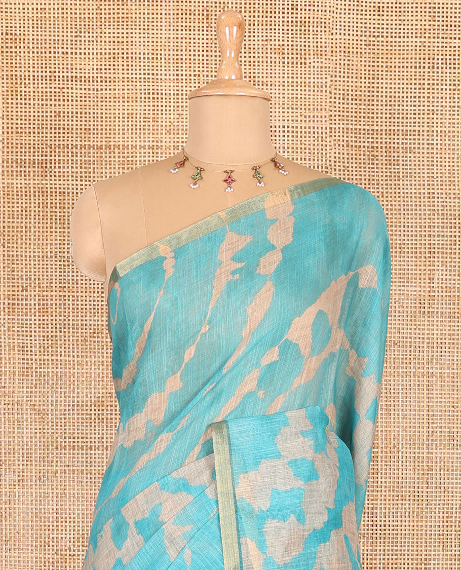 Borderless rama blue batik printed linen cotton saree, hand brush painting style floral vine printed pallu, and contrast floral printed blouse