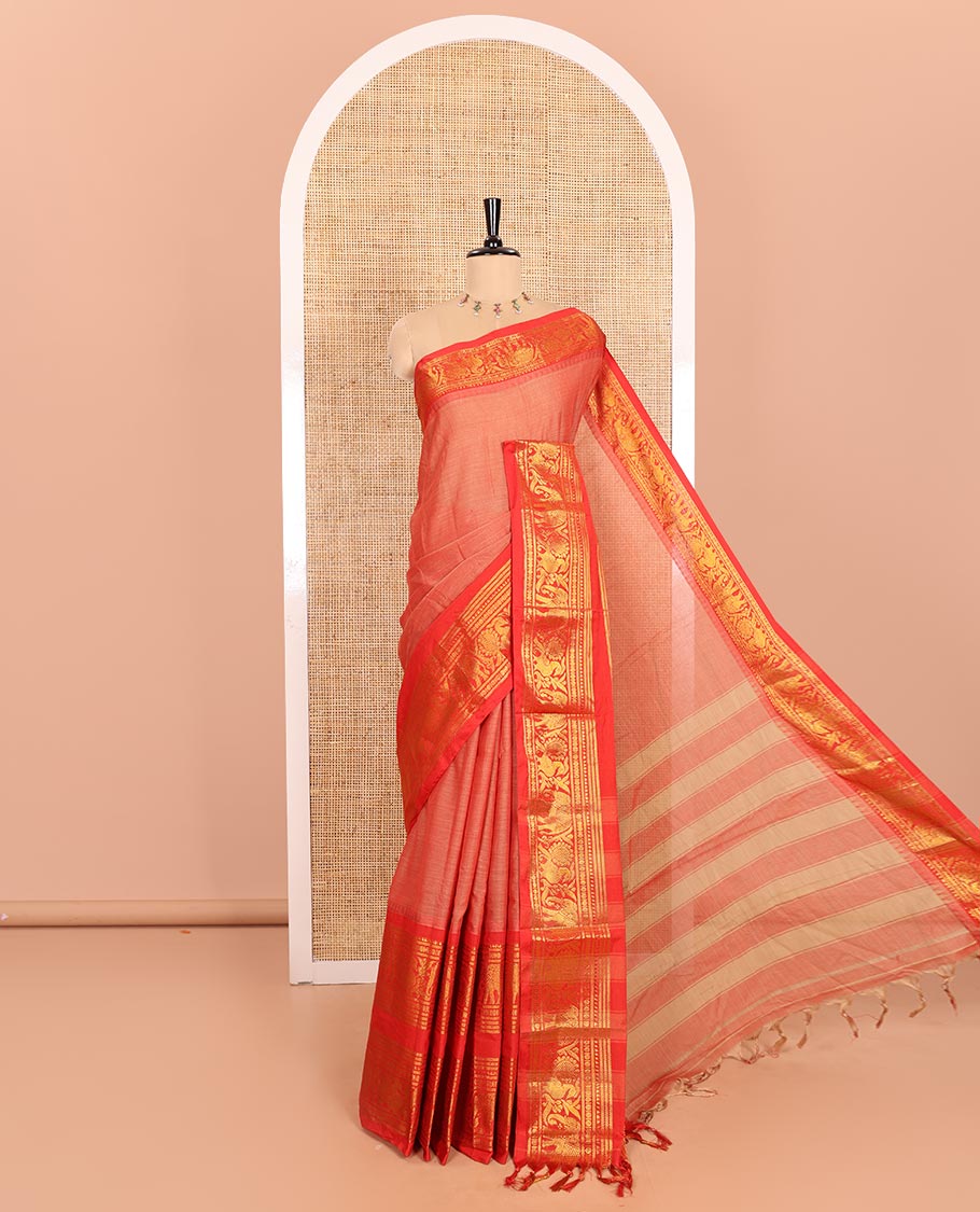 Light Rust Orange Plain Mercerised Cotton Saree Highlighted with a Contrasting Rettai Pettu Border Featuring Peacock and Elephant Motifs in Zari, a Subtly Striped Pallu, and a Matching Blouse