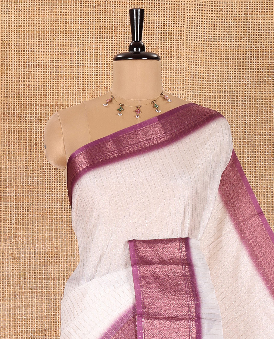 White and Purple Dola Silk Saree Embellished with Vertical Zari Stripes All Over the Body, Complemented by a Contrast Border of Traditional Zari Designs, Self-Pallu of Stripes, and Paired with a Contrast Blouse