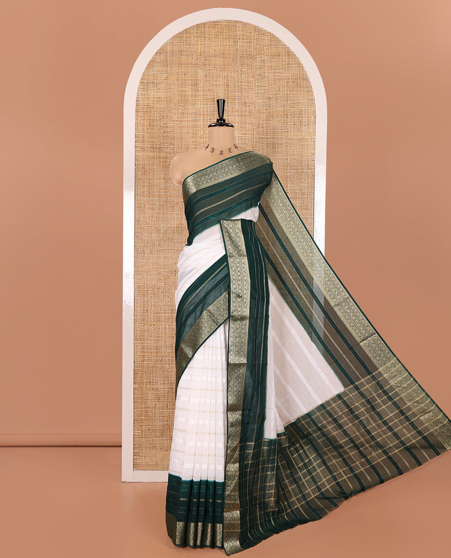 White and Green Georgette Saree, Subtly Sparkled with Horizontal Zari Stripes All Over Its Body, Complemented by a Contrast Traditional Zari Design Border, Gleaming Zari Striped Pallu, and Paired with a Contrast Blouse