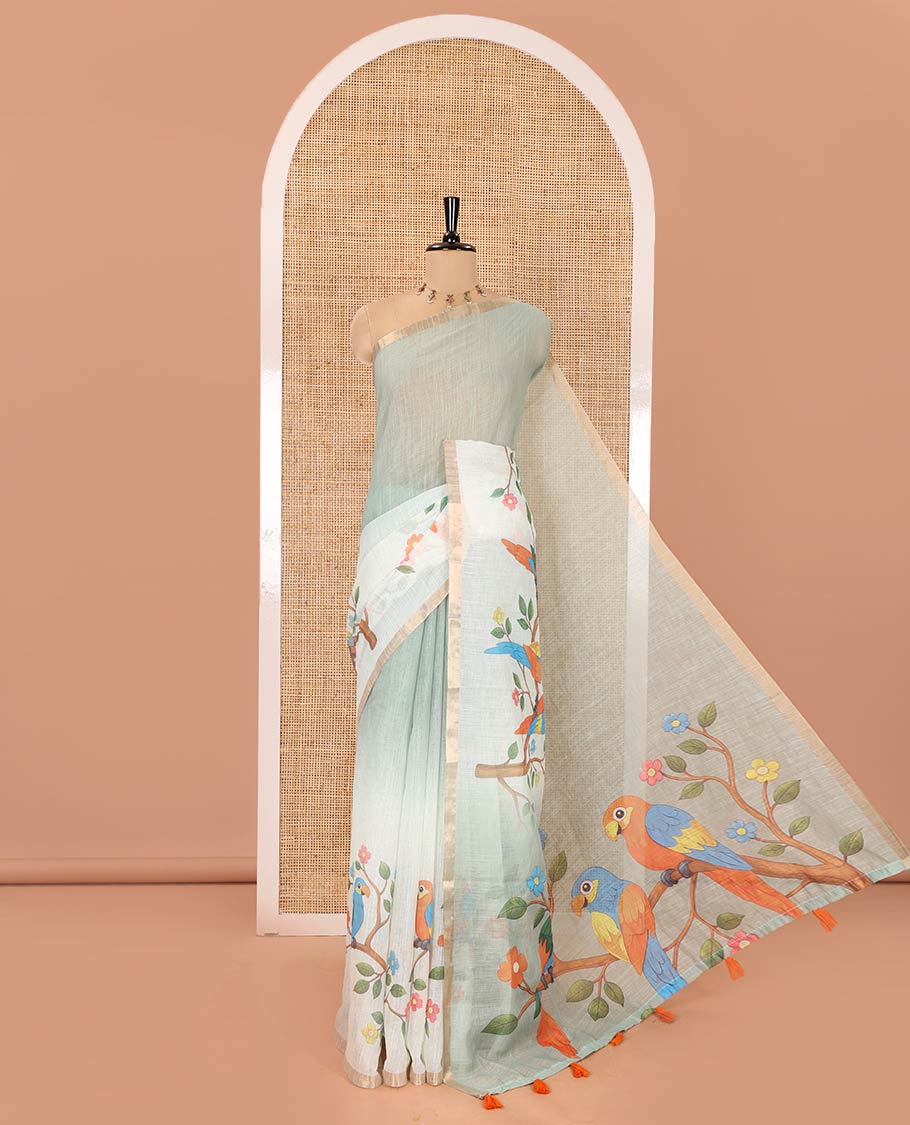Green Linen Saree, Beautifully Decked Up with Colorful Tree and Macaw Parrot Motifs Printed on Its Body, Subtle Zari Border, Pallu of the Same Tree and Macaw Parrot Motifs Printed, and Comes with a Matching Blouse