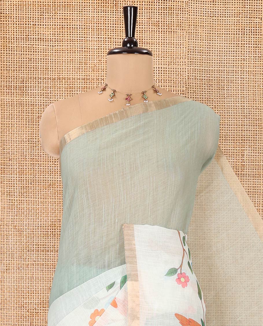 Green Linen Saree, Beautifully Decked Up with Colorful Tree and Macaw Parrot Motifs Printed on Its Body, Subtle Zari Border, Pallu of the Same Tree and Macaw Parrot Motifs Printed, and Comes with a Matching Blouse