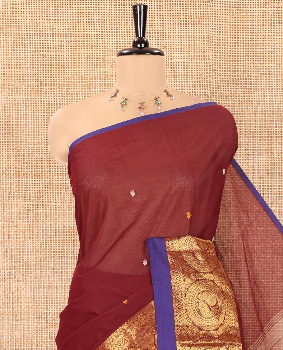 Maroon Chettinad Cotton Saree, Elevated with Thread Buttas All Over Its Body, Highlighted by Traditional Zari Border of Round Peacock Designs, Subtly Striped Pallu, and Paired with a Matching Blouse