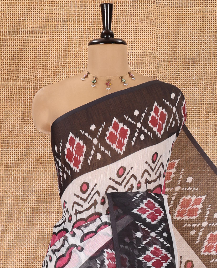 White and Black Linen Cotton Saree, Colorful Ikat Woven On Its Body, Complemented by Contrast Ikkat Geometric Border, Pallu Steeped with Buttas and Paired with a Contrast Blouse