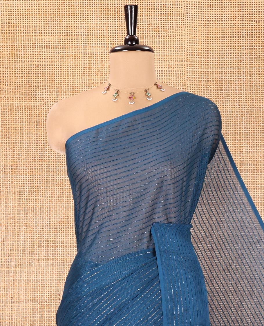 Borderless Blue Chiffon Saree, Gleamed Up with Horizontal Stripes on Its Body, a Self-Pallu, and Comes Without a Blouse
