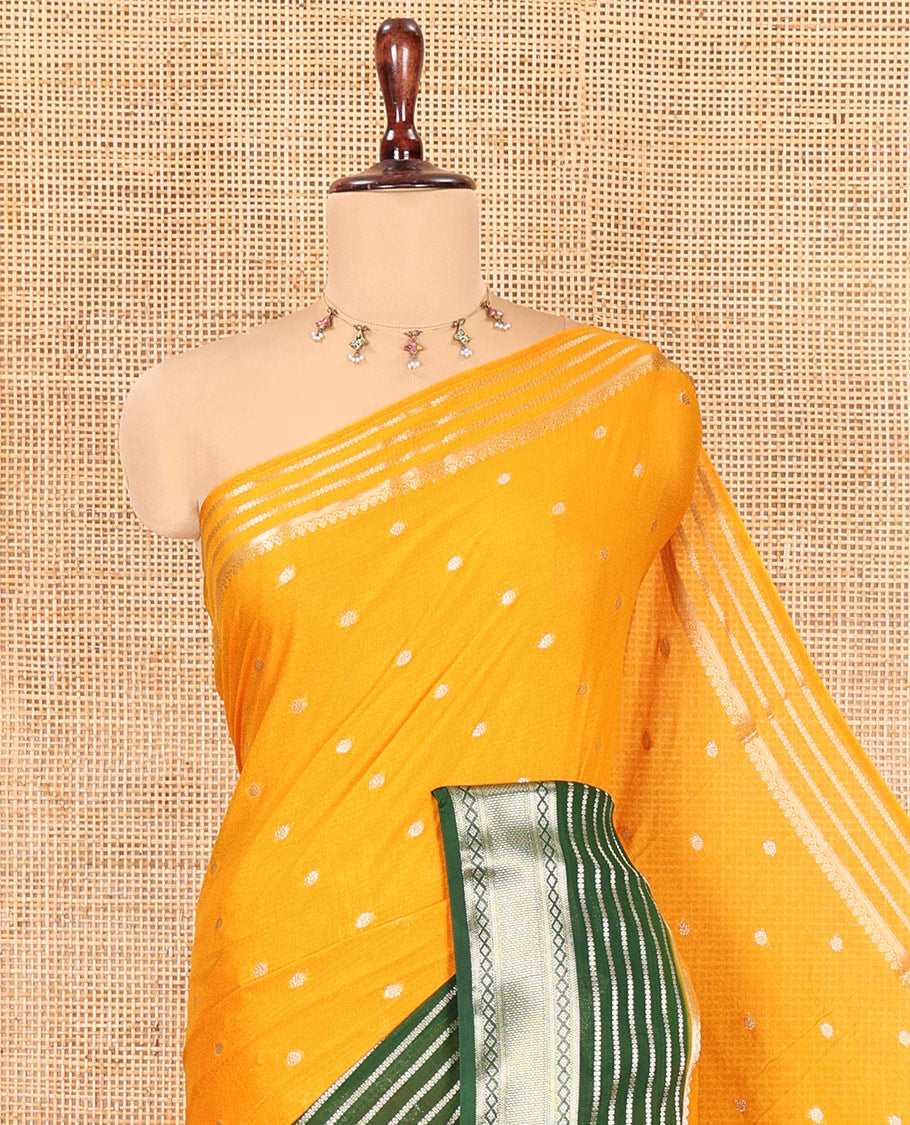 Yellow Art Crepe Saree Features Zari Buttas, Complemented by Contrast Traditional Zari Border, Zari Striped Pallu, and a Contrast Blouse