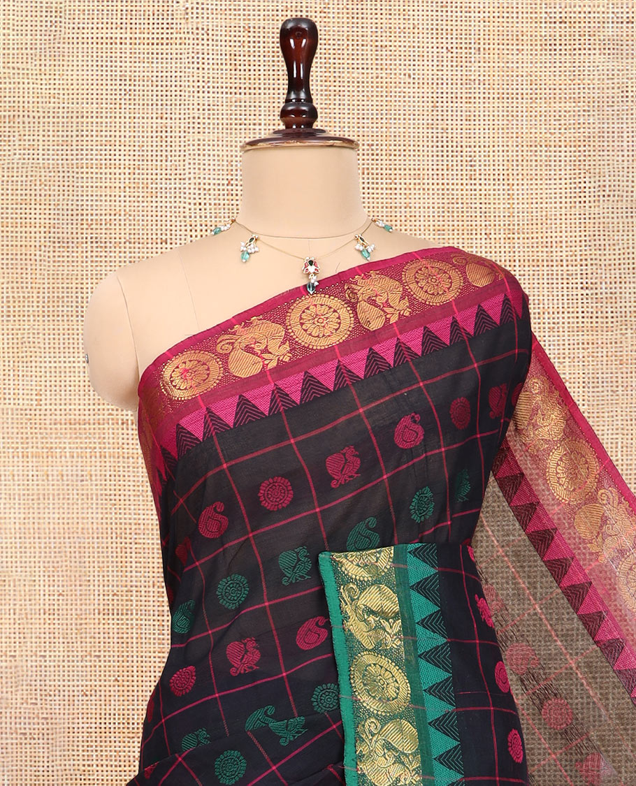 Black Chettinad Cotton Saree Features Butta Enclosed Checks, a Contrast Temple Annam-Peacock Ganga-Jamuna Border, and a Matching Blouse