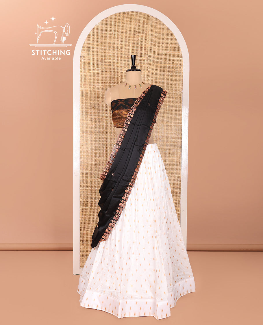 Cream and Black Half-Saree Featuring Gold Zari Buttas Steeped Nylon Viscose Skirt, Complemented by a Contrast Jacquard Zari Design Blouse, and Comes with a Syska Georgette Embroidered Scallop-Bordered Dhavani