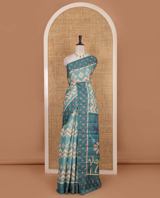 Sea Green pochampally ikkat style geometric printed fancy tussar saree, contrast floral motifs thread embroidered border, ikkat printed pallu, and plain blouse