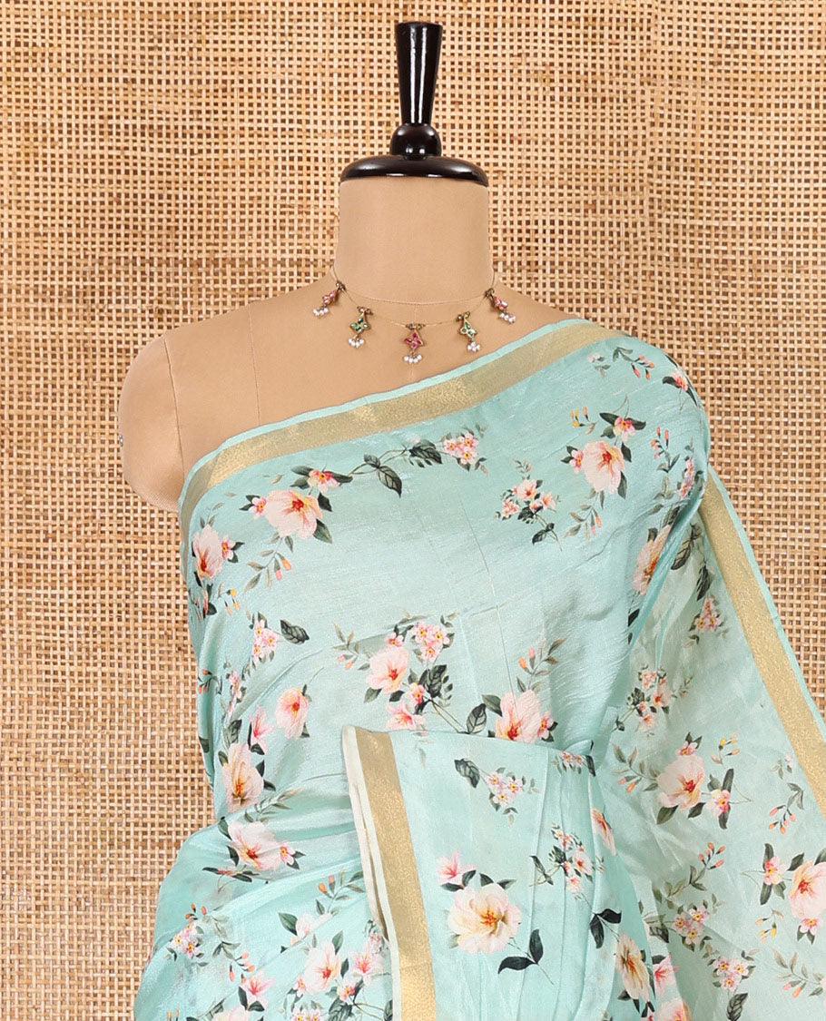 Mint green floral motifs digital printed banana pith saree, piping border, striped pallu, and floral printed blouse