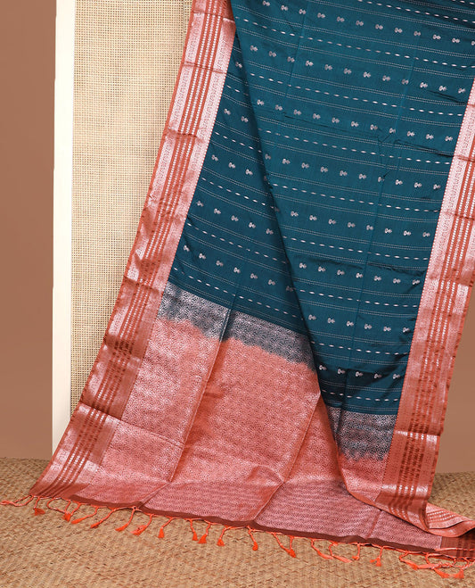 Peacock blue zari designs silk saree, contrast traditional zari border, and floral design pallu