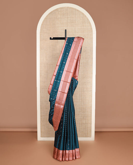 Peacock blue zari designs silk saree, contrast traditional zari border, and floral design pallu