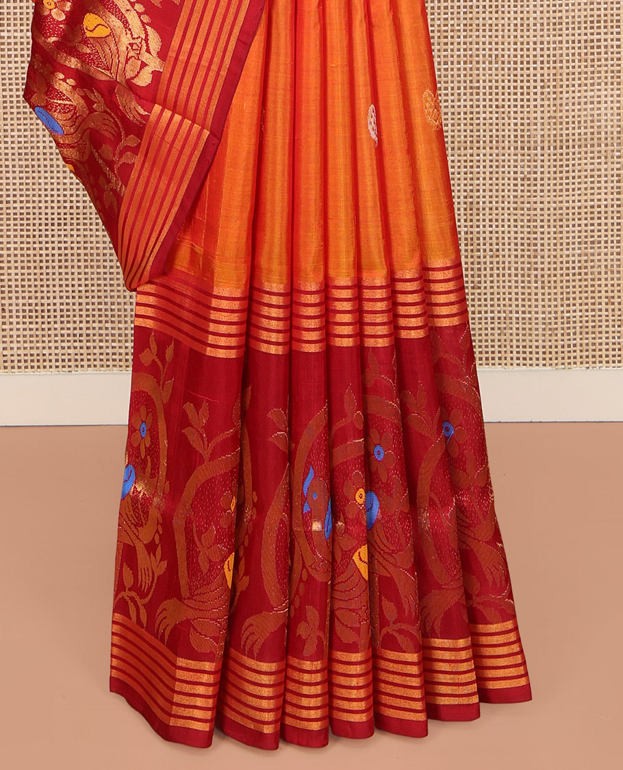 Orange Uppada Silk Saree, Decked Up with Zari Buttas on Its Body, Complemented by a Contrast Border Featuring Floral and Meenakari Bird Designs, Pallu Steeped with Flower Designs, and Paired with a Contrast Blouse