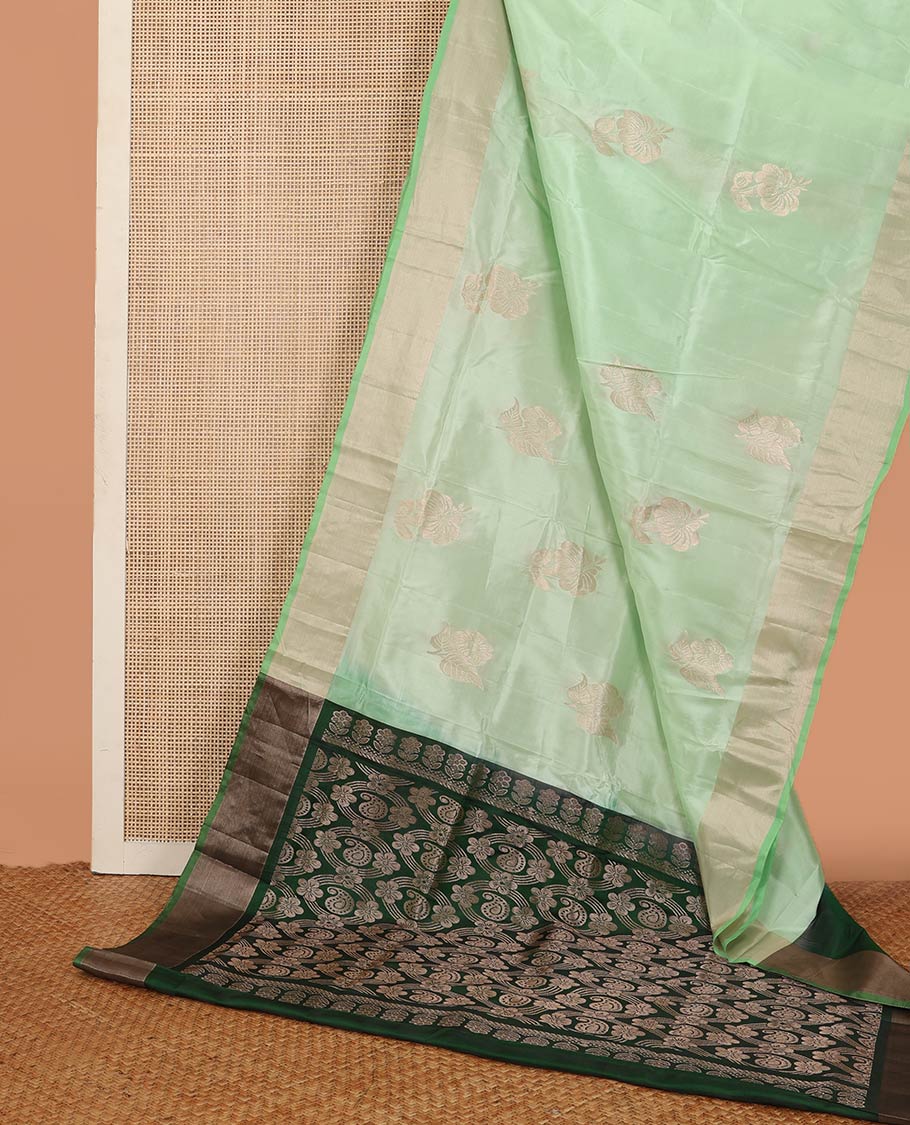 Pista green zari buttas Uppada saree, bavanji border, and contrast paisley design pallu
