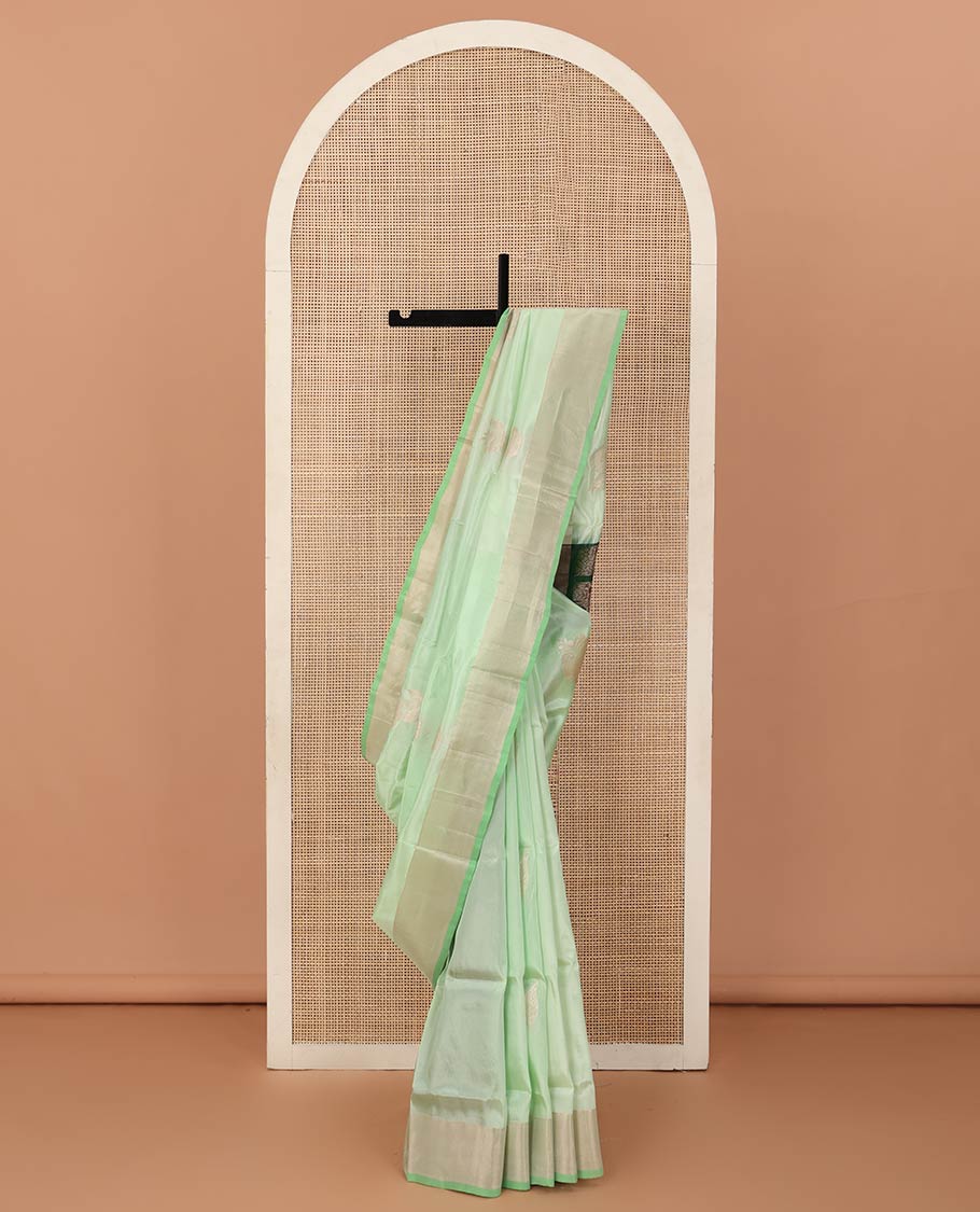 Pista green zari buttas Uppada saree, bavanji border, and contrast paisley design pallu