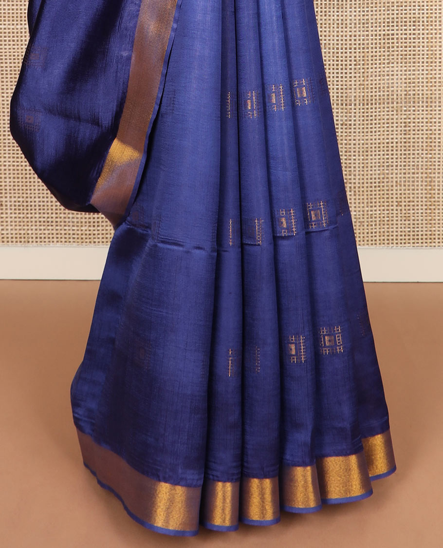 Navy blue buttas banana pith saree, bavanji zari border, and zari striped pallu