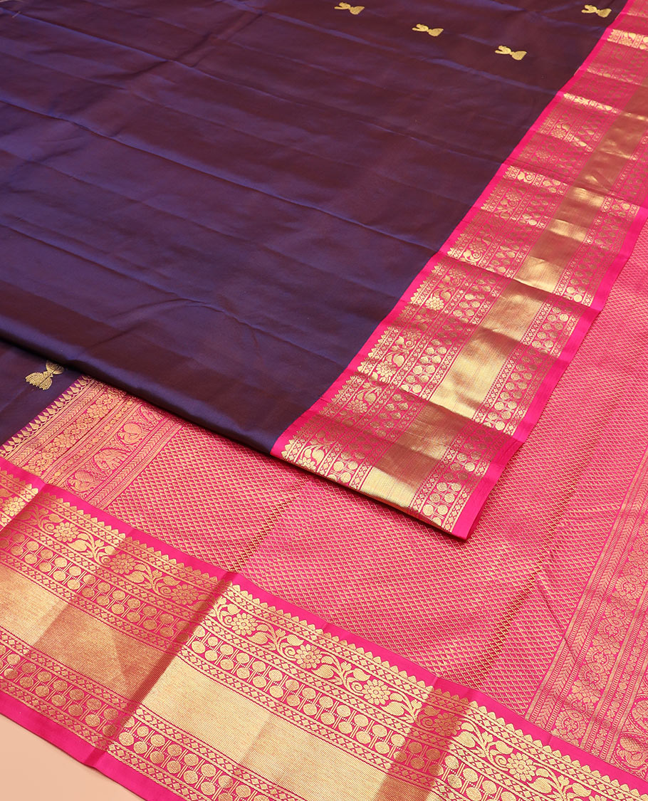 Navy Blue Vasundhara Silk Saree Adorned with Zari Buttas, Complemented by a Contrast Border of Thilakam, Diamond, Kodi Visiry, and Rudraksham Designs, Delicately Woven Pallu of Ara Maadam Designs, and a Contrast Blouse